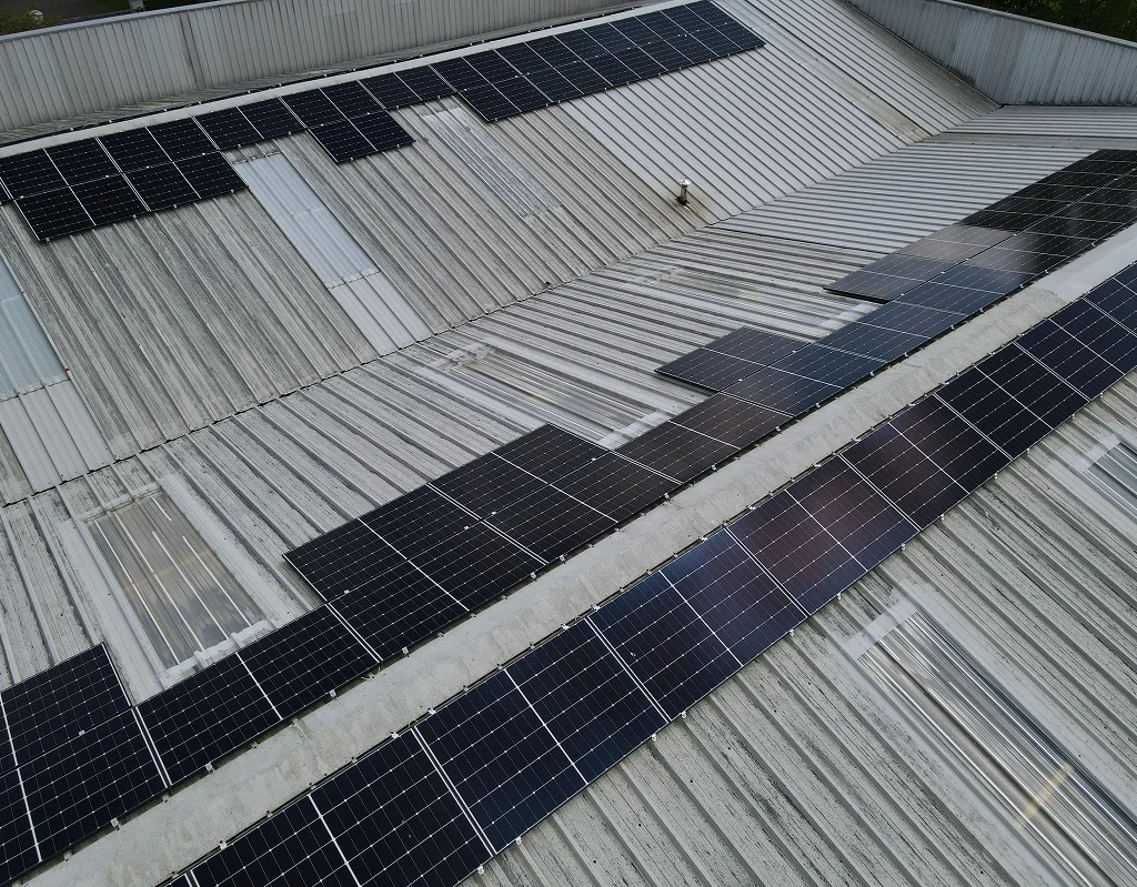 Panel rows on the McGuigan Furniture manufacturing building, mid-install